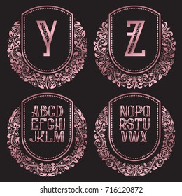 Rose gold monograms set in antique style. Vintage logos with Y, Z and other letters of the English alphabet.