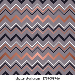 Rose gold seamless pattern. Background stripe chevron. Elegant zigzag lines. Repeating delicate chevrons striped texture for design. Roses golden backdrop for prints, fabric, wallpaper, textile