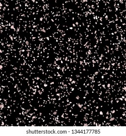 Rose gold terrazzo texture. Vector seamless pattern with chaotic scattered golden confetti on black background. Terazzo mosaic flooring background. Luxury repeat design. Holiday festive fun concept