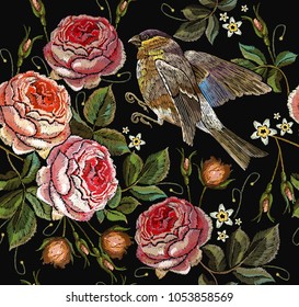 Roses and birds embroidery seamless pattern. Classical embroidery vintage buds of roses and titmouse on black background. Fashionable template for design of clothes, t-shirt design, tapestry flowers 
