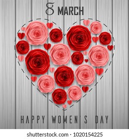 Roses in a shape of heart for International Happy Women's Day on wooden background