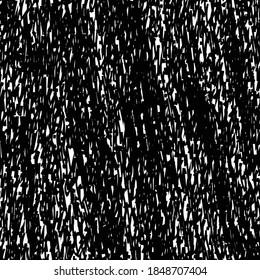 Rough flecked material with a few folds. Textured background in black and white.