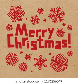 Rough inscription Merry Christmas and snowflakes red on craft paper. Snow stickers. Vector winter holidays decoration on cardboard background