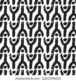 Rough seamless pattern made of black and white repeating elements.