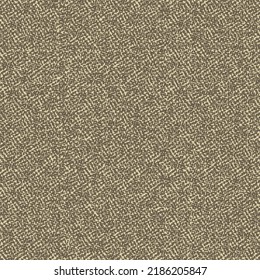 Rough strong fabric made from hemp, jute or cotton. Coarse textile material in brown and beige tones. Mottled textured background.