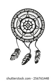 Round amulet with ethnic patterns. Ends with pendants in the form of feathers