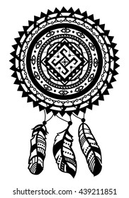 Round amulet with ethnic patterns. Ends with pendants in the form of feathers
