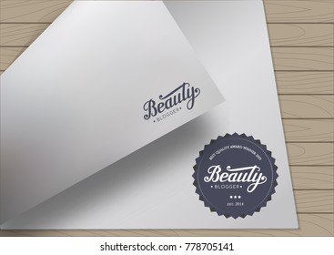 Round Badge Beauty Blogger with Hand Drawn Letteringon Bent A4 Sheet Template Wooden Background. Black Logo Emblem Vector Illustration. Can be used for Logotype, Branding.