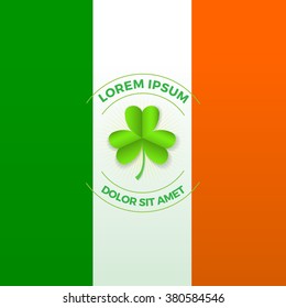 Round badge with sample text and shamrock in the middle. National flag of Ireland on the background. Irish symbols. St. Patrick's day celebration. Vector illustration.