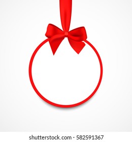 Round banner with red ribbon and bow, isolated on white background. Christmas tree decoration. Greeting card template.