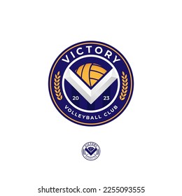 Round blue and yellow Victory Volleyball Club emblem logo with V chevron and ball inside. The single-color version is included.