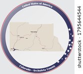 Round button with detailed map of Archuleta County in Colorado, USA.