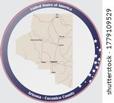 Round button with detailed map of Coconico County in Arizona, USA.