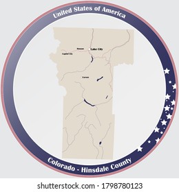 Round button with detailed map of Hinsdale County in Colorado, USA.