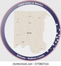 Round button with detailed map of Madison county in Alabama, USA.