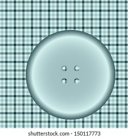 round button on a checkered cloth surface