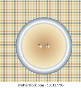 round button on a checkered cloth surface