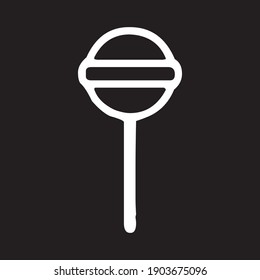 a round candy with a circular ridge in the center and a handle