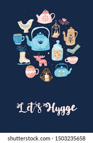Round composition of Hygge attributes, kitchen items and home decorations isolated on dark background: kettle, mug, lamp, socks, cookies, candles, books, skates. With lettering text Let's Hygge.