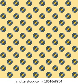 Round dark shining vintage CD disc for music play on yellow background repeat pattern