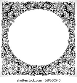 Round decorative frame from imaginary doodle flowers black and white drawing