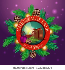 Round discount Christmas banner with Christmas tree branches, garland and gifts with old lamp