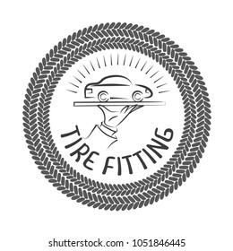 Round emblem with a spanners border, car and inscription - tire fitting. Vector illustration.