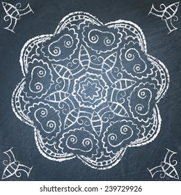 Round filigree hand drawn ornament on chalkboard