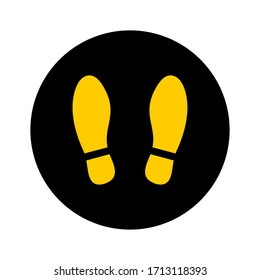 Round Floor Marking Stand Here Icon with Shoe Prints for Queue Line or Other Purposes Requiring Social Distancing. Vector Image.