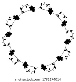 Round floral decor or frame. Wreath of viola tricolor branches. Vintage style. Black silhouette on white background.