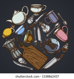 Round floral design on dark background with Chef's knifes, teaspoon, spoon, fork, knife, cutting board, bottle of oil, teapots, coffee pot, cups, sugar bowl, pepper shaker, salt shaker