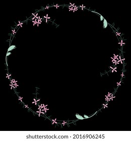 Round floral frame with blooming branches of pink flowers. Delicate wildflower wreath. On black background.