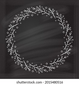 Round floral frame on a chalkboard background. Spring wreath. Monogram, wedding invitation or greeting card template.