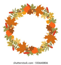 Round frame of autumn leaves, berries and acorns.