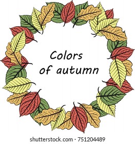 Round frame of autumn leaves of different colors