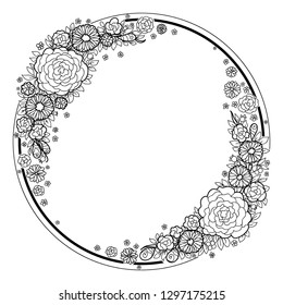 The round frame is black and white with a floral ornament, the decor is made of roses, daisies and simple flowers.