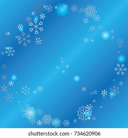 Round frame or border Christmas background with random scatter falling silver snowflakes, blue blurred lights and sparkles on a blue background