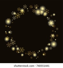 Round frame or border Christmas background with random scatter falling gold snowflakes and yellow blurred lights isolated on black.