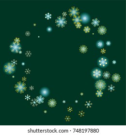 Round frame or border Christmas background with random scatter falling golden snowflakes and blue blurred lights on a dark green background.