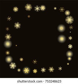 Round frame or border Christmas background with random scatter falling gold snowflakes and yellow blurred lights isolated on black.
