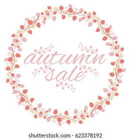 Round frame of branches with leaves and berries with the inscription: "autumn sale".