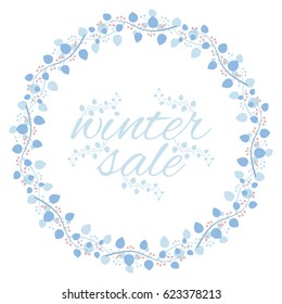 Round frame of branches with leaves and berries with the inscription: "winter sale".