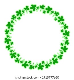 Round frame with clover leaves.Magical plant. Decoration for St. Patrick's Day with trefoils and quatrefoils. Shamrock. Irish story. Isolated on white.