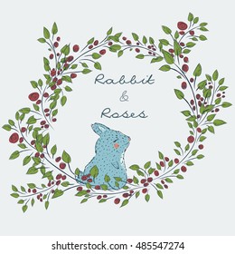 Round frame from the collection of hand-drawn cute natural frame from branches of a rose with a blue rabbit. floral borders. Cute  bunny. Winter rabbit in flowers