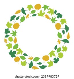 The round frame created with different leaves. Decorative element created from Leaves of oak, ginkgo, maples, and other trees.