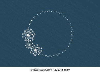 Round frame of dandelions on a dark blue background