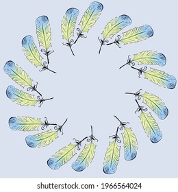 Round Frame of Feathers on Light Blue Background