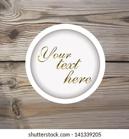 Round frame on the background of wooden boards