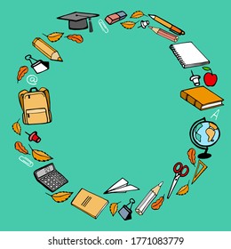 Round frame from school supplies on the colored background