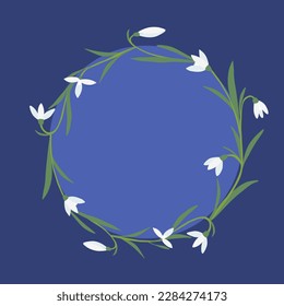 Round frame with snowdrops spring flowers on blue background, place for text, vector